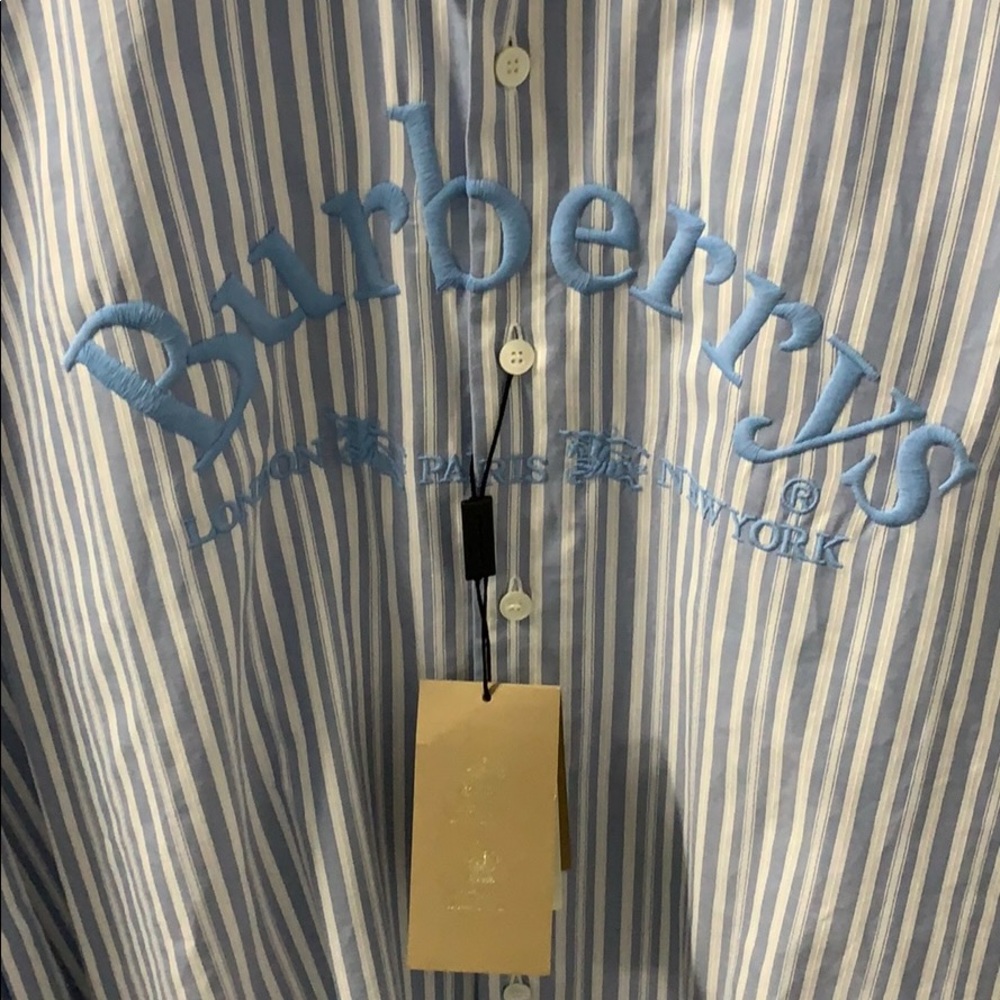 Men’s Burberry shirt with branding/logo on front.